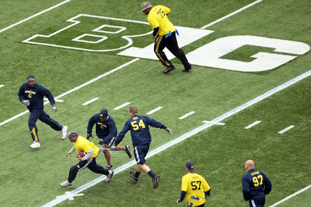 Former University of Michigan football players participate in the annual alumni flag football game before spring practice at Michigan Stadium on Saturday, April 13, 2013. Melanie Maxwell I AnnArbor.com